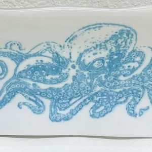 An intricately designed glass plate with the image of an octopus, showcasing detailed tentacles made at Glass Duchess Studio in Port Charlotte, FL