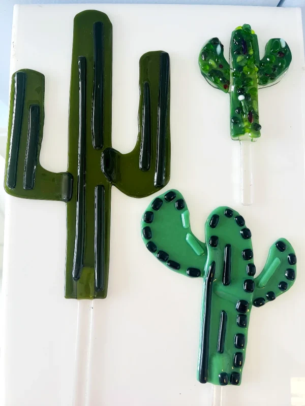 Three decorative plant stakes in the shape of various cactus plants made at Glass Duchess Studio, Port Charlotte FL