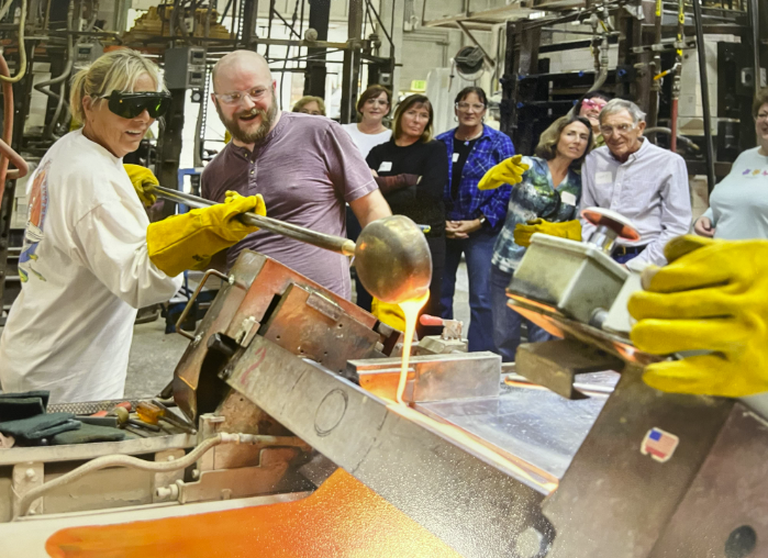Scientists conducting a molten metal experiment in a lab.